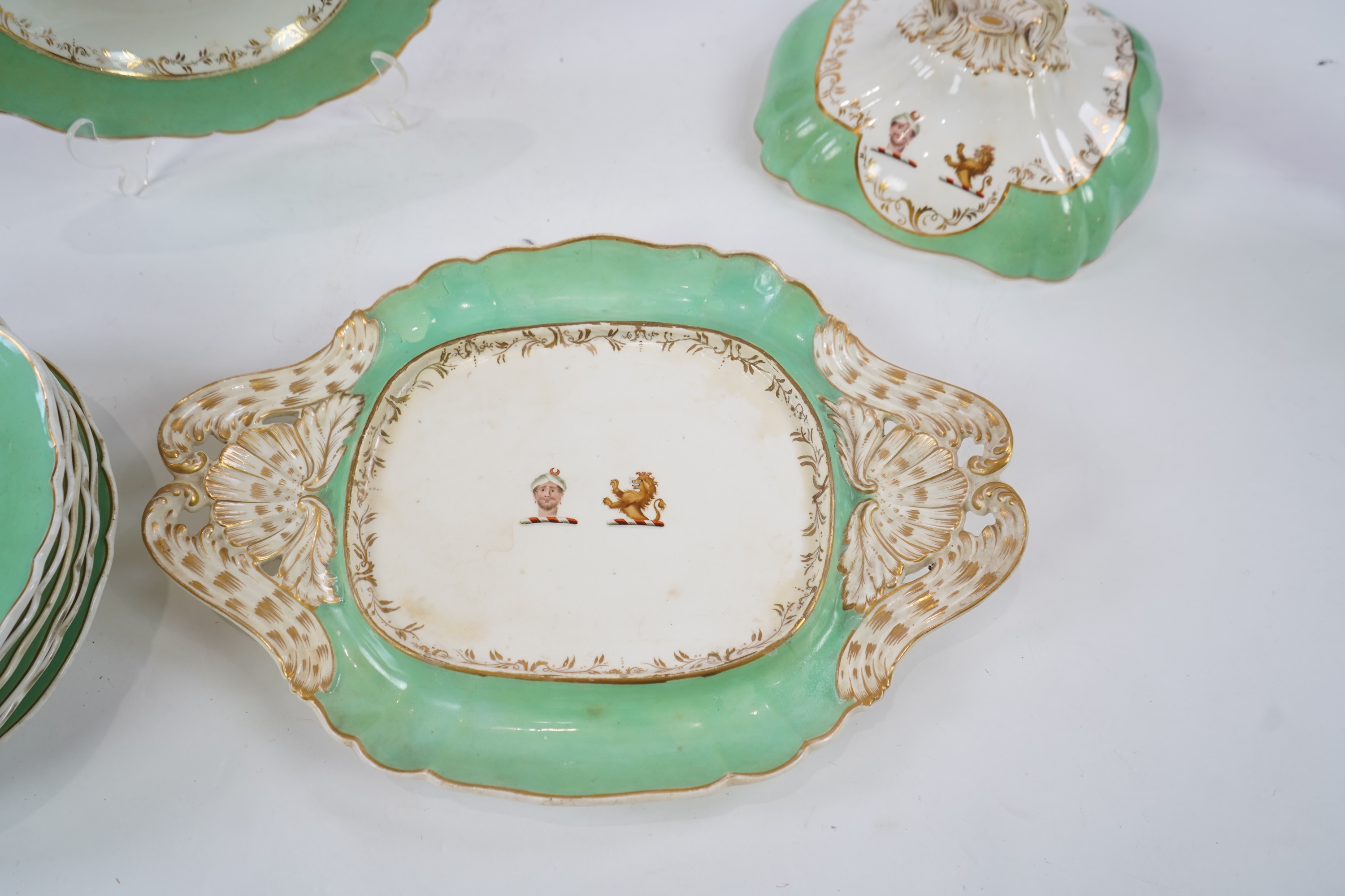 An English porcelain Turks head crested part dinner service, c.1830